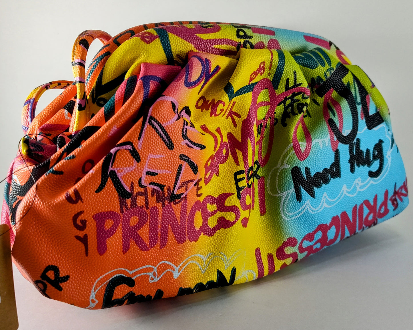 "Multicolor Graffiti Handbag – Edgy, Street Art-Inspired Statement Bag" P 114