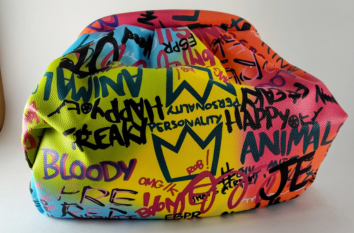 "Multicolor Graffiti Handbag – Edgy, Street Art-Inspired Statement Bag" P 114