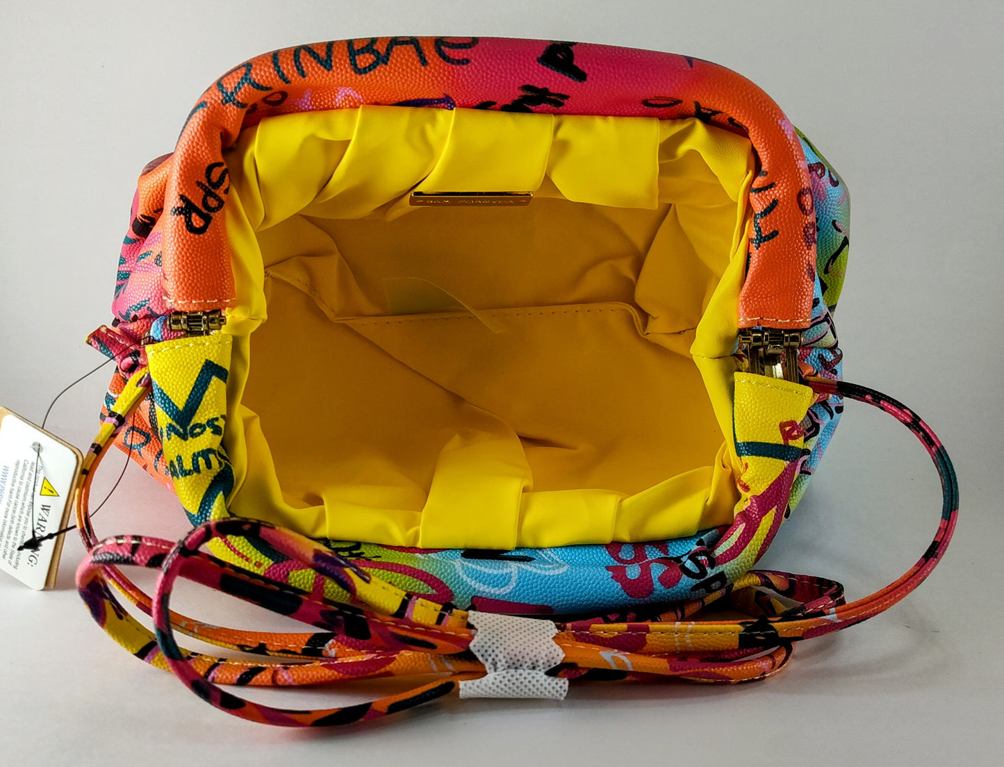 "Multicolor Graffiti Handbag – Edgy, Street Art-Inspired Statement Bag" P 114